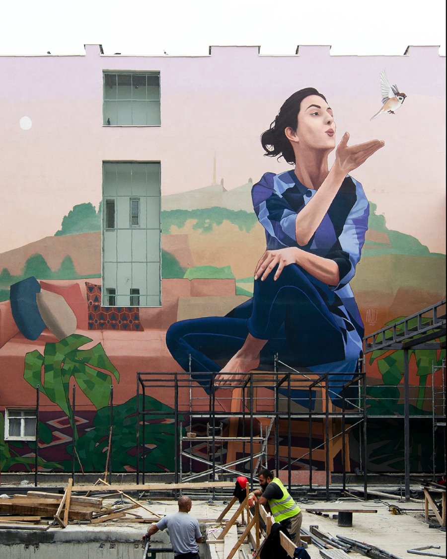 Woman with sparrow, part of Artez's latest mural