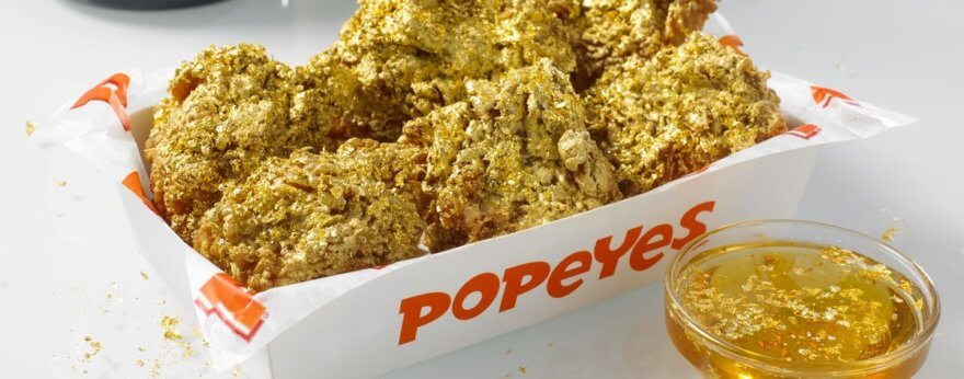 Popeyes presenta alitas de pollo bañadas en oro