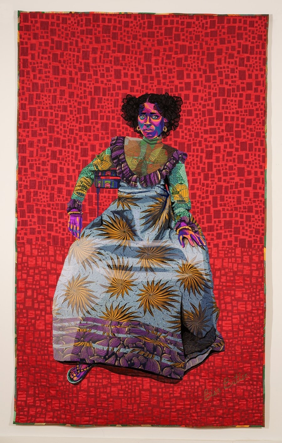 Obra textil con el retrato de mujer negra