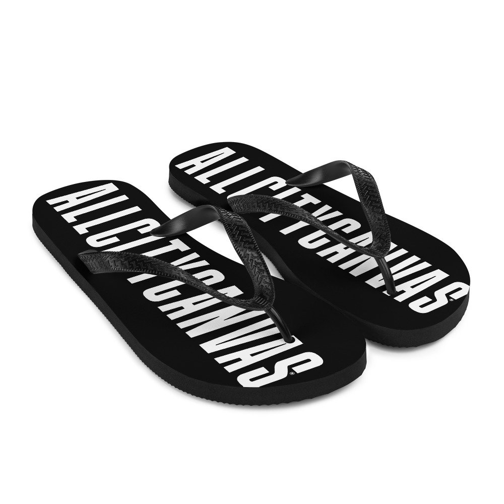 ACC black flip flops with white typography